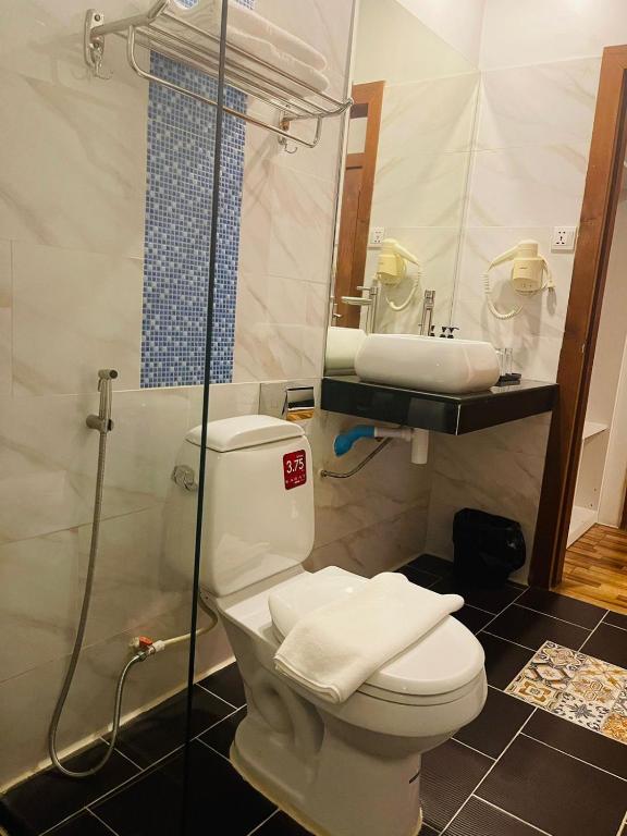 Koupelna v ubytování DE Hotel