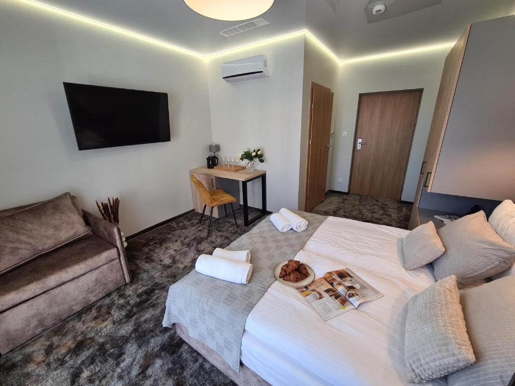TV a/nebo společenská místnost v ubytování BALTIC RESIDENCE
