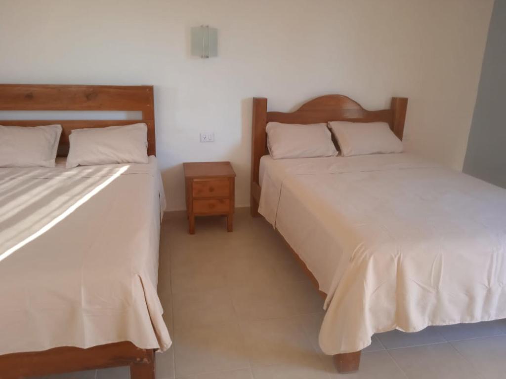 Postel nebo postele na pokoji v ubytování Ecohotel Shalom