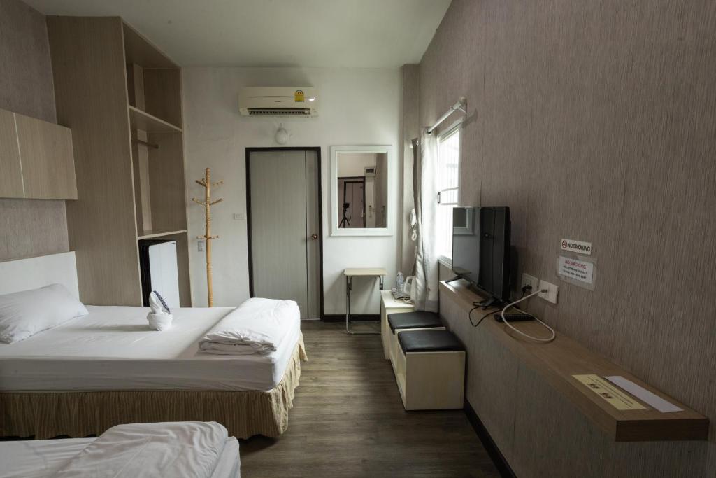 Postel nebo postele na pokoji v ubytování Connect Hotel Chiang Rai