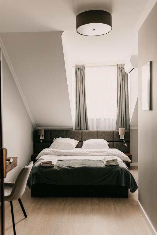 Posteľ alebo postele v izbe v ubytovaní Hotel Millenium