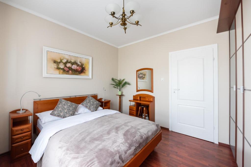 Posteľ alebo postele v izbe v ubytovaní Arkadia Homely Apartament