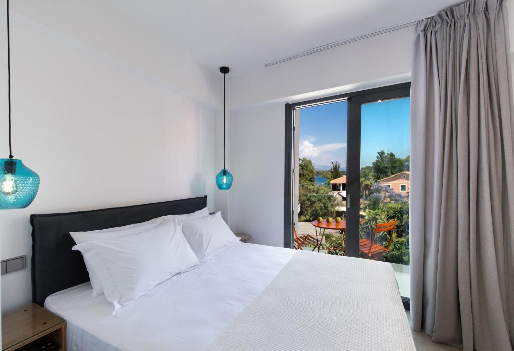 Posteľ alebo postele v izbe v ubytovaní Azul Apartments