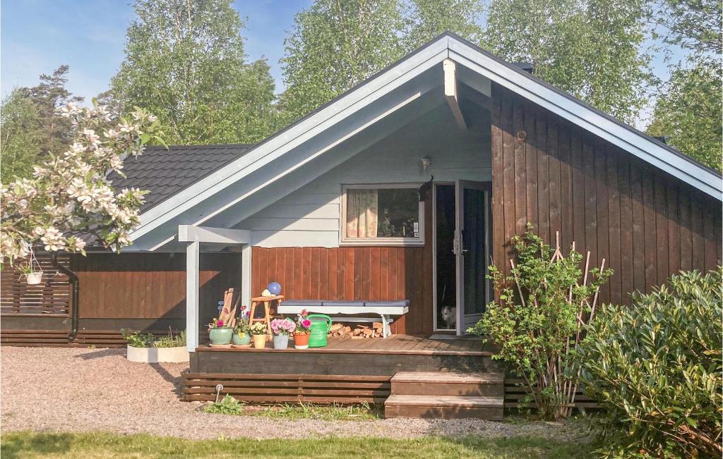 a small house with a porch and a patio at Lovely Home In Heberg With Sauna in Heberg