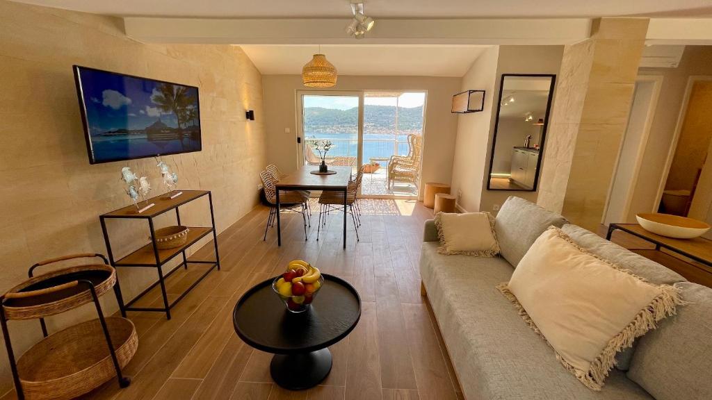 a living room with a couch and a table at ViSun Apartment 2 in Vis
