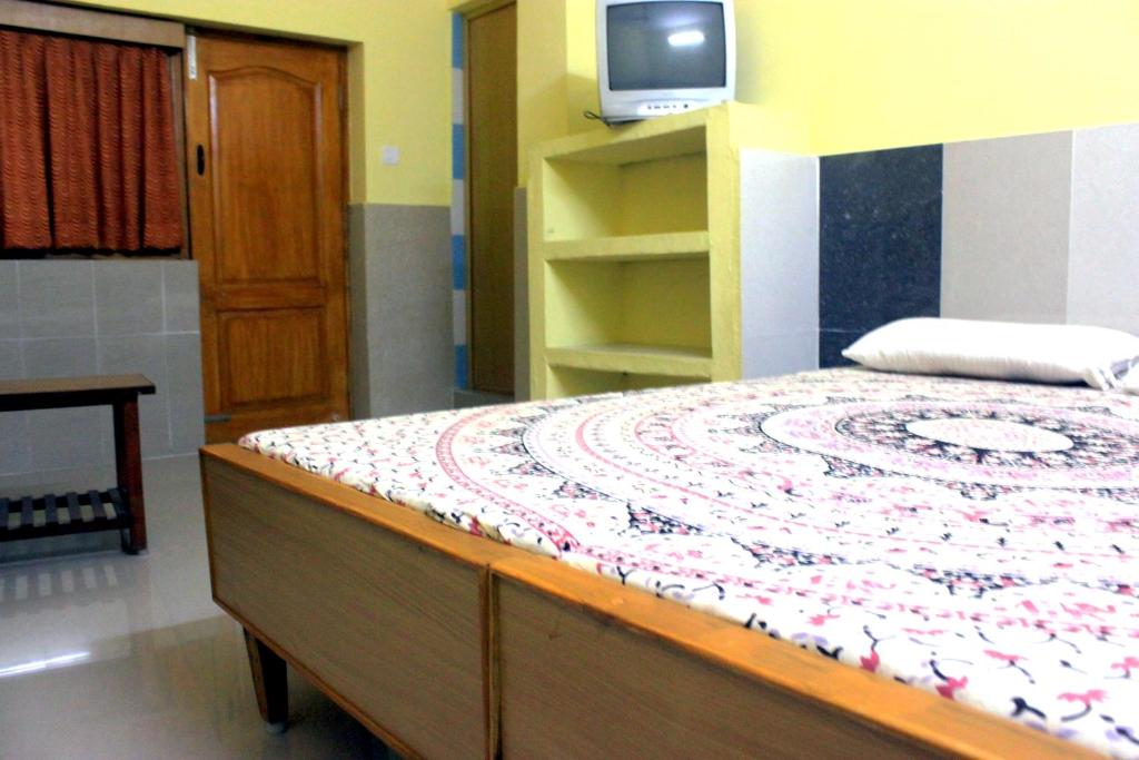 Letto o letti in una camera di Vinodhara Guest House