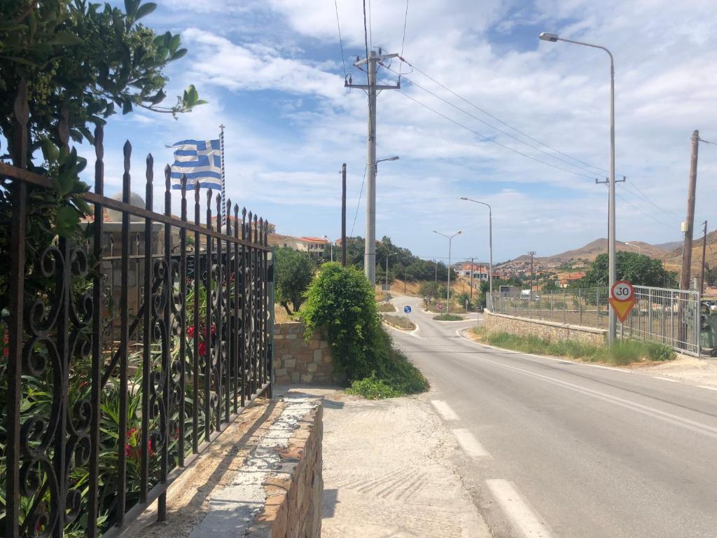 an iron fence on the side of a road at Gregory's Village in Platy