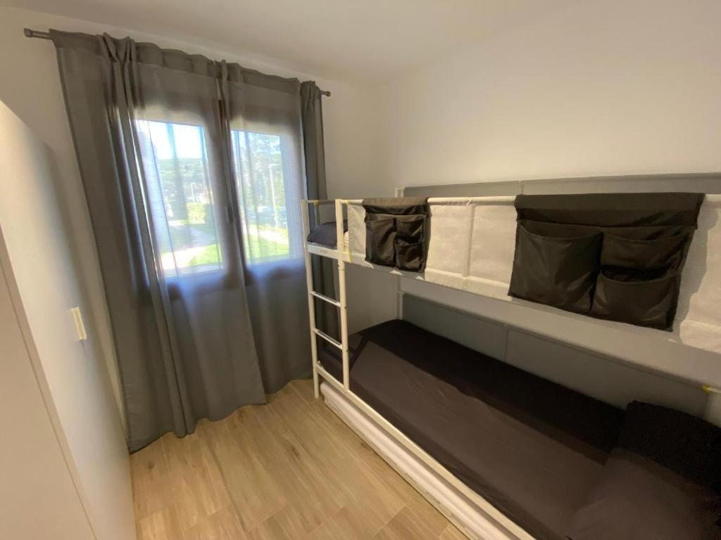 Posteľ alebo postele v izbe v ubytovaní Apartamento Cala Montgo
