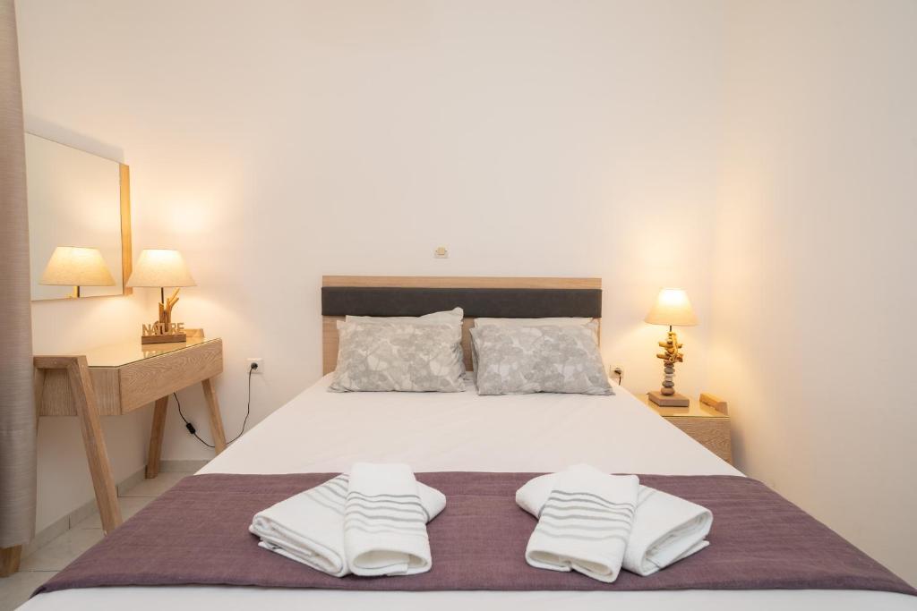 Postel nebo postele na pokoji v ubytování Iris Apartments