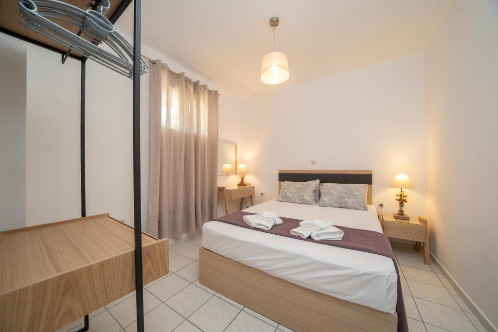 Postel nebo postele na pokoji v ubytování Iris Apartments