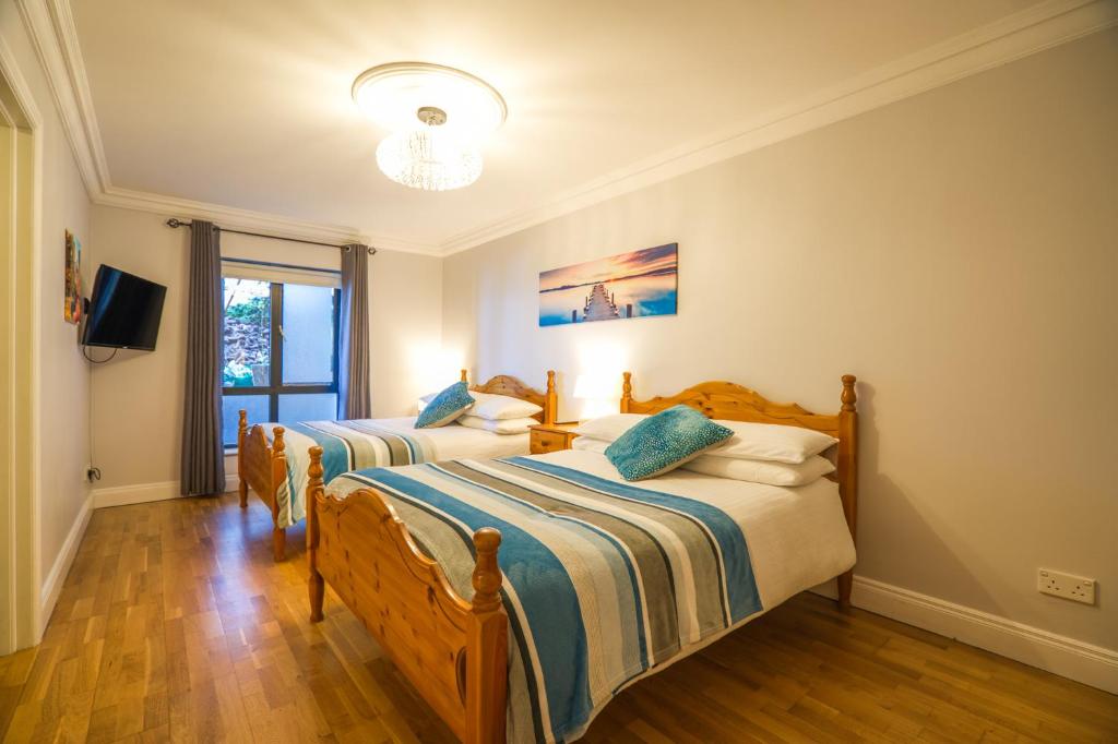 Postel nebo postele na pokoji v ubytování Fintra Beach B&B