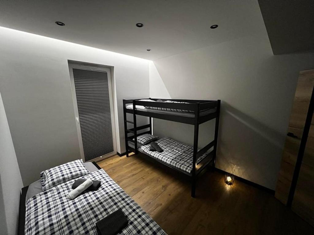 Posteľ alebo postele v izbe v ubytovaní Apartament Helsinki