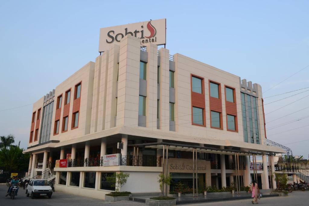 a building with a sign on the top of it at Sobti Continental Bareilly in Bareilly