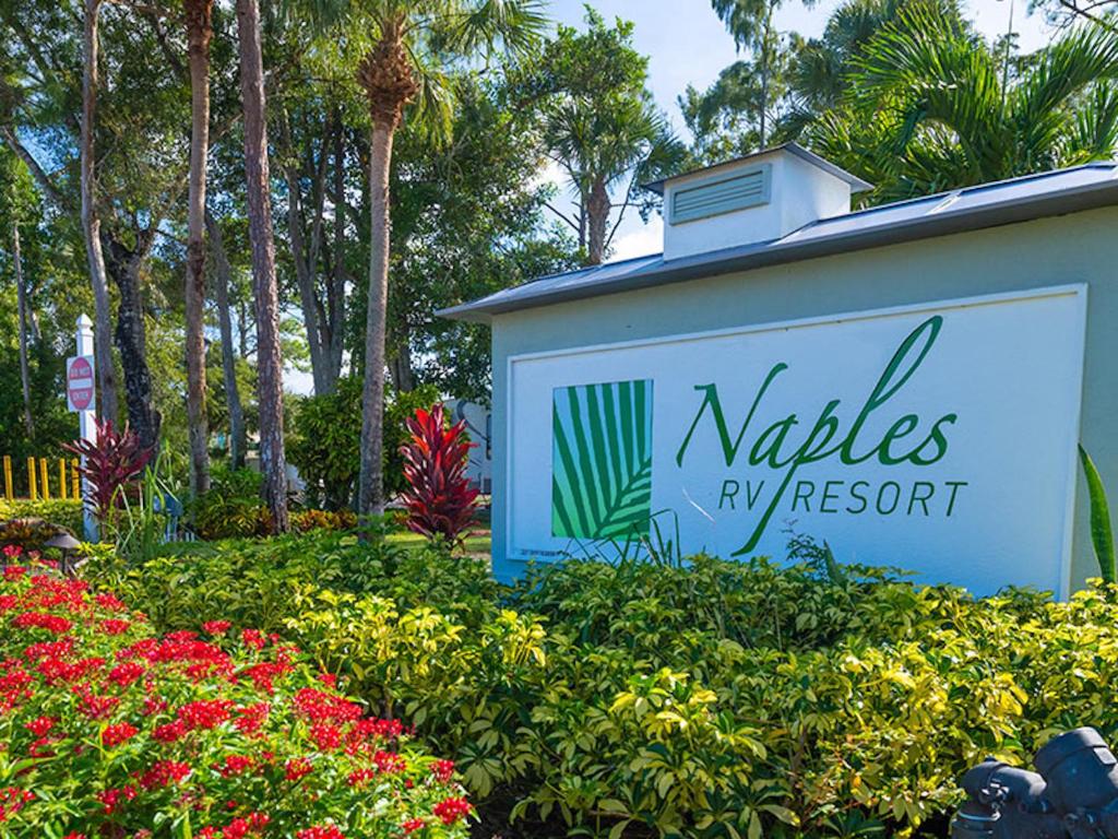 a sign for a niles ry resort with flowers at Social Distanсing Approved Nature Getaway! in Naples