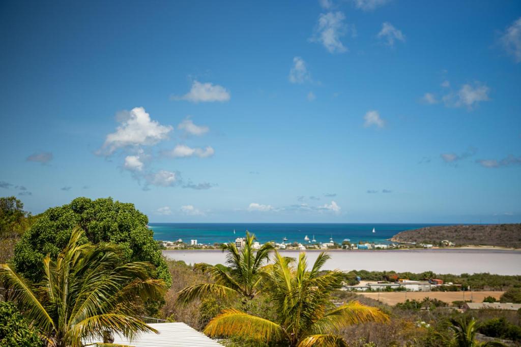 a view of the ocean from a resort at Easy Corner Villas in Sandy Ground Village