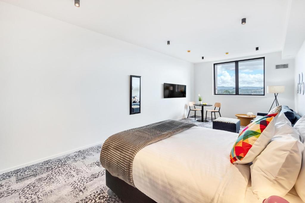 Roomie Apartment Hotel房間的床
