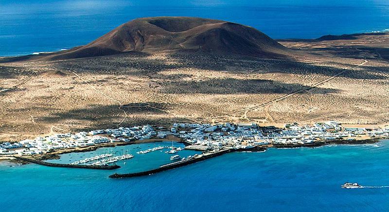 an aerial view of a small island in the ocean at Apartamentos Burgao in Caleta de Sebo