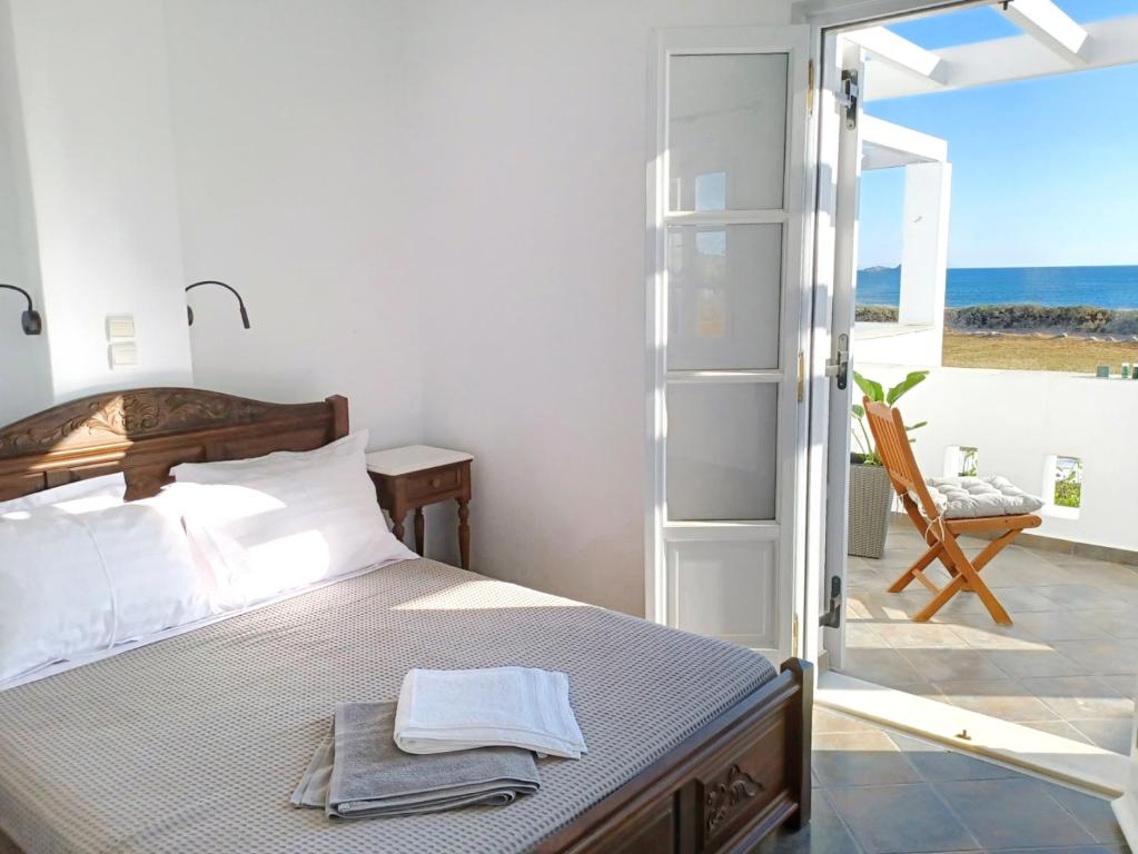Postel nebo postele na pokoji v ubytování Sea Lilies Suites