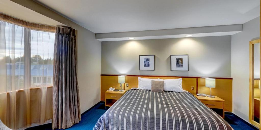 Postel nebo postele na pokoji v ubytování Distinction Luxmore Hotel