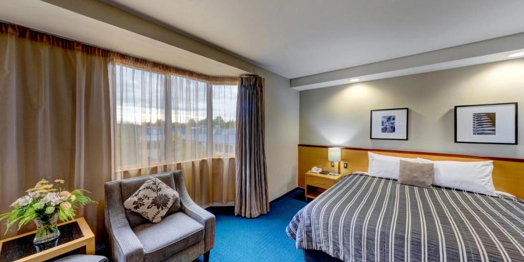 Postel nebo postele na pokoji v ubytování Distinction Luxmore Hotel