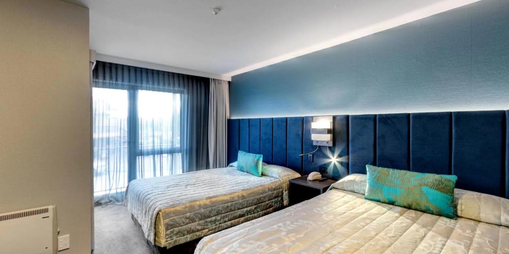 Postel nebo postele na pokoji v ubytování Distinction Luxmore Hotel