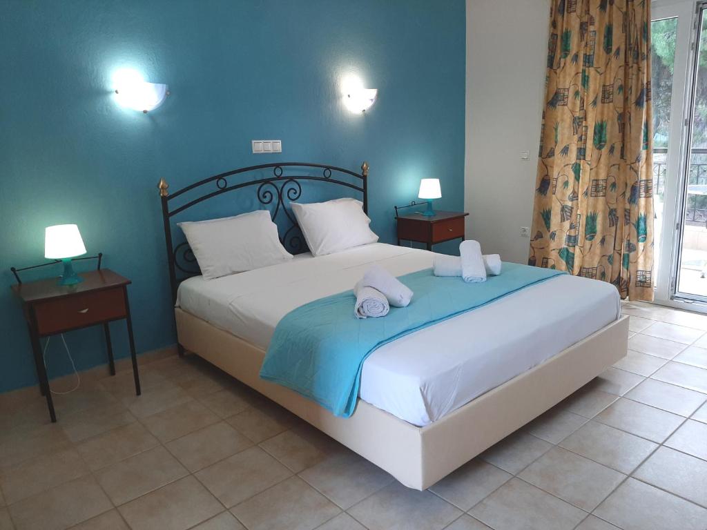 Ένα ή περισσότερα κρεβάτια σε δωμάτιο στο Loxandra Studios 