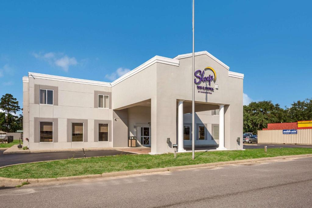 a large white building with a sign on it at Sleep Inn & Suites Niceville - Destin in Niceville