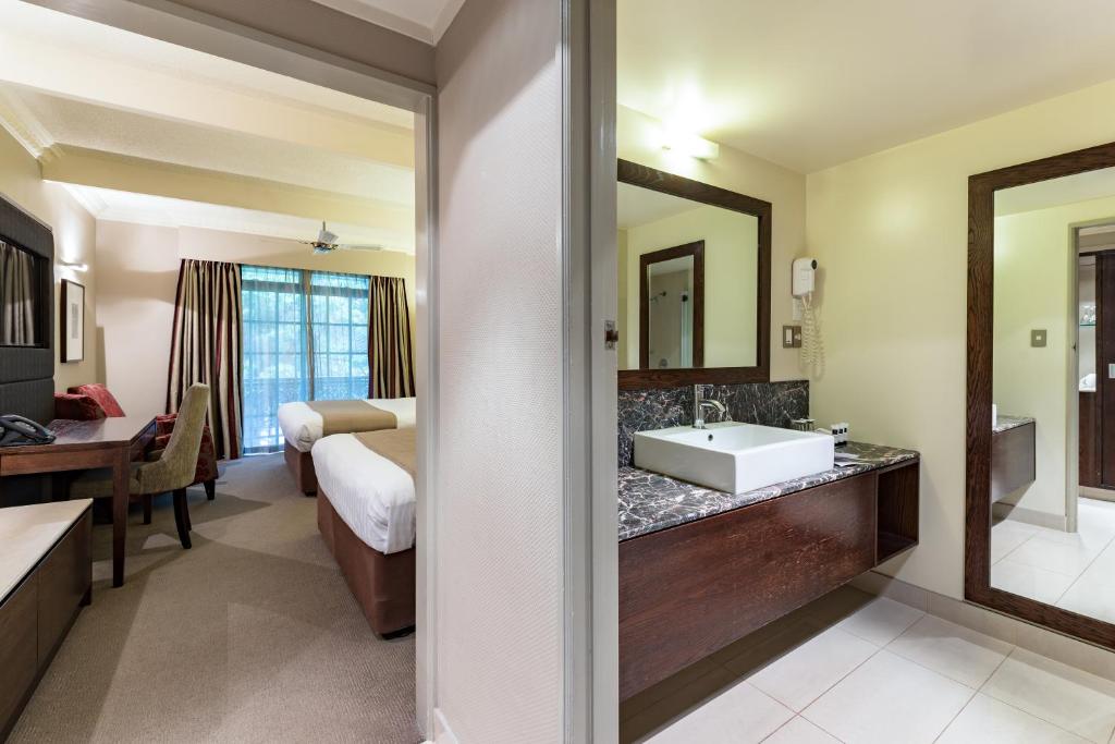 Postel nebo postele na pokoji v ubytování Distinction Hotel Rotorua