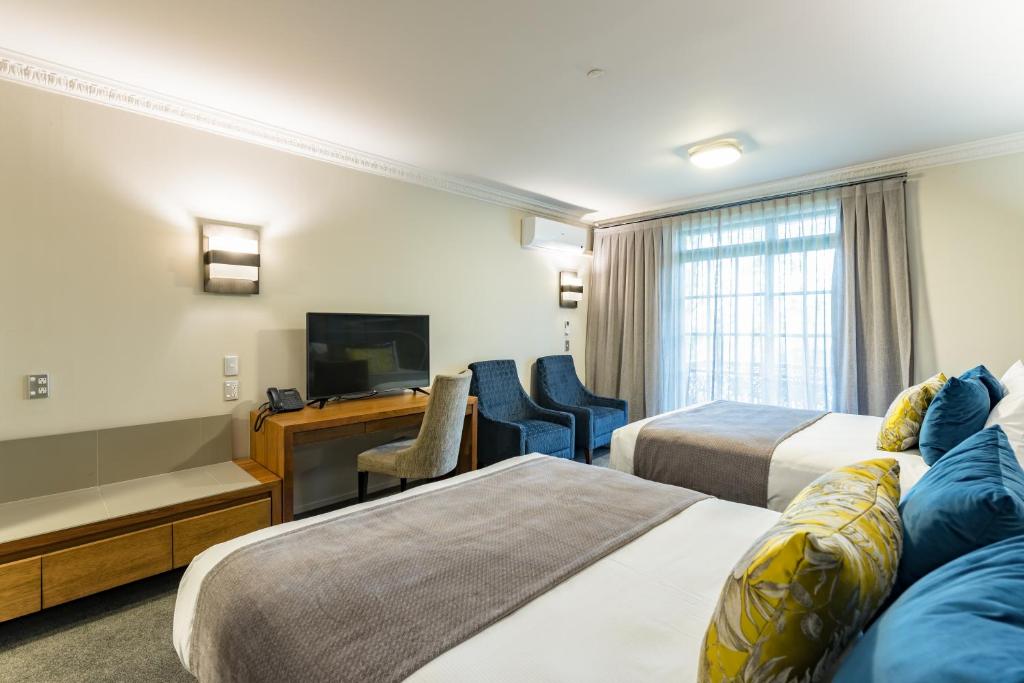 Postel nebo postele na pokoji v ubytování Distinction Hotel Rotorua