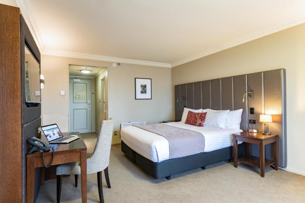 Postel nebo postele na pokoji v ubytování Distinction Hotel Rotorua
