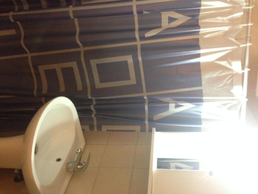 Koupelna v ubytování Marvi Hotel