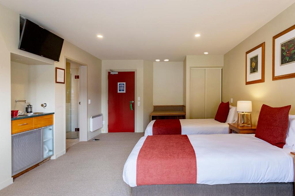 Postel nebo postele na pokoji v ubytování Te Weheka Boutique Hotel