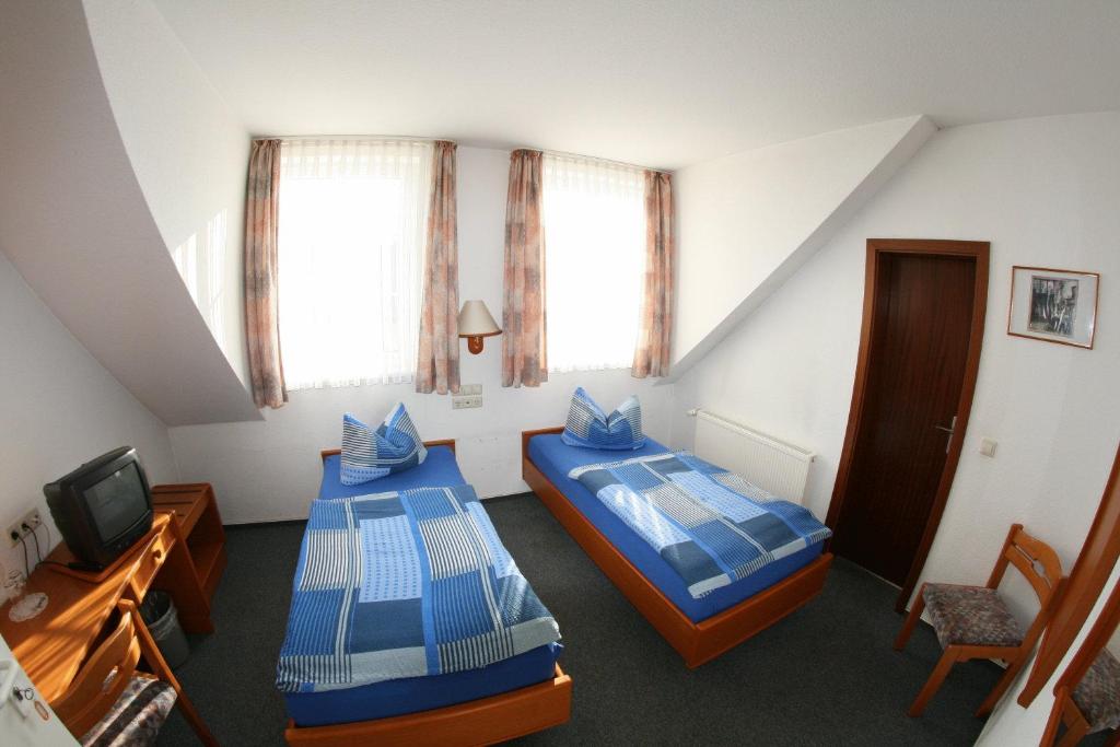 Postel nebo postele na pokoji v ubytování Wehrstedter Hof