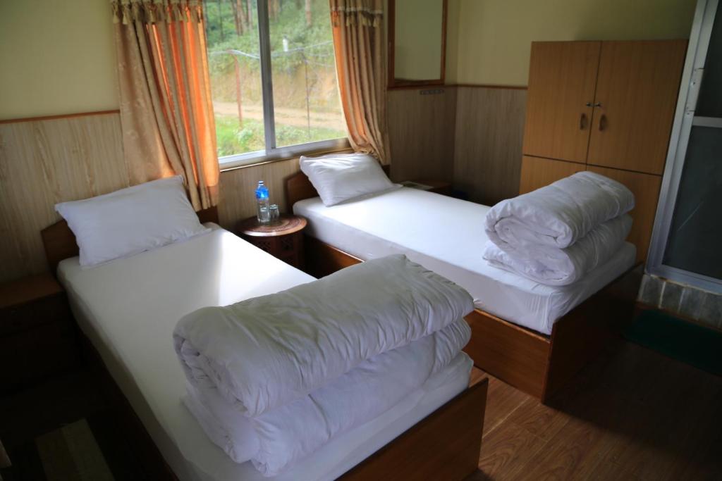 Postel nebo postele na pokoji v ubytování Hotel Mount Paradise