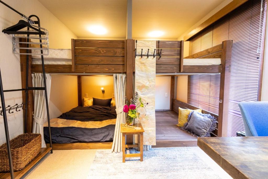 a room with two bunk beds and a table at Hotel Tokyo Hub - Vacation STAY 27692v in Tokyo