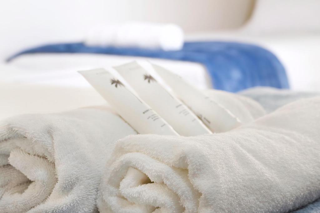 Postel nebo postele na pokoji v ubytování Hotel Tropiq