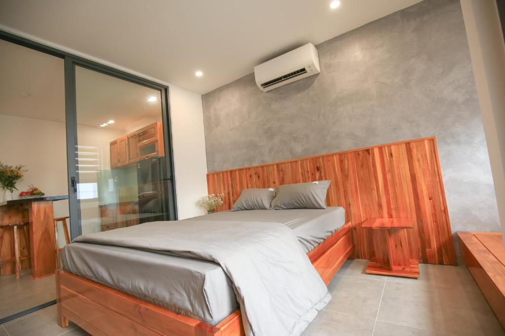 Postel nebo postele na pokoji v ubytování LH APARTMENT DA NANG