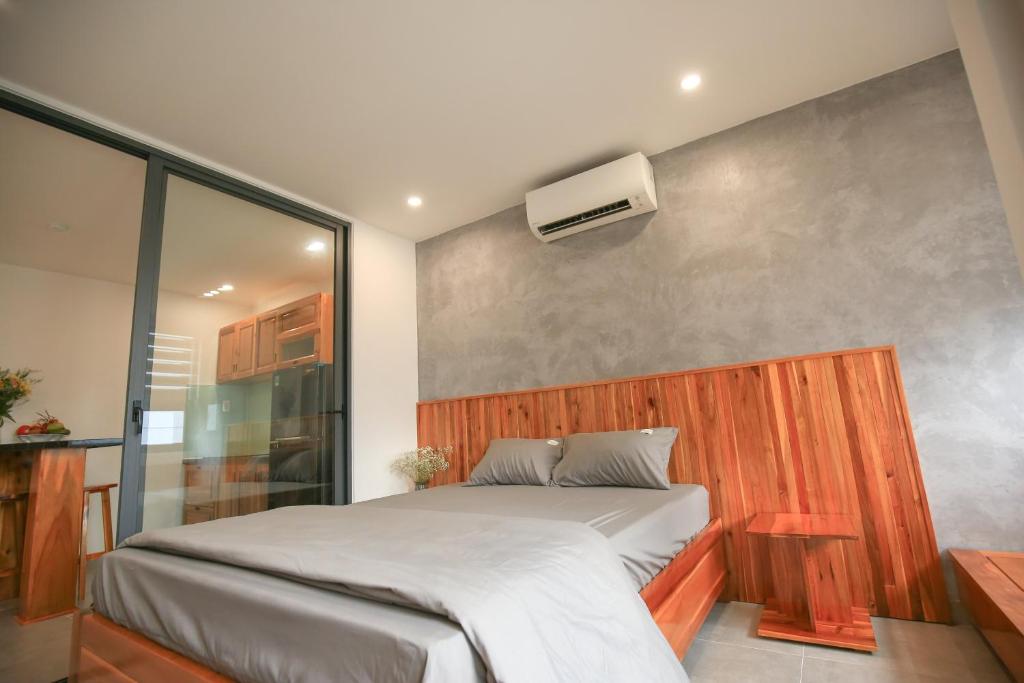 Postel nebo postele na pokoji v ubytování LH APARTMENT DA NANG