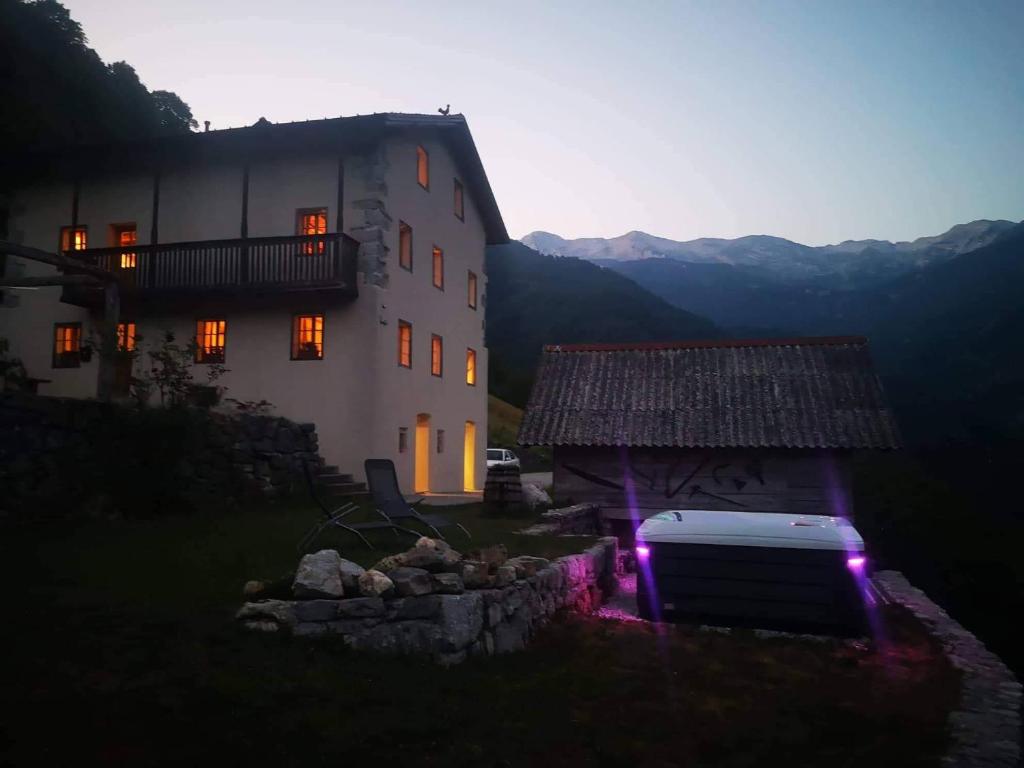 a large building with purple lights in front of it at Apartment Abinkar in Tolmin