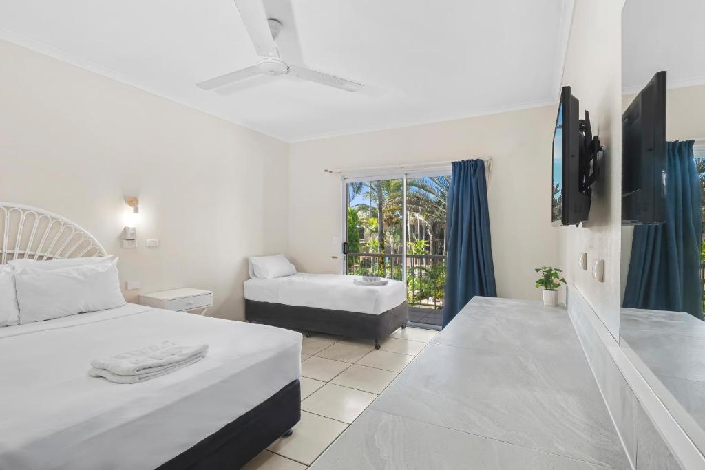 Postel nebo postele na pokoji v ubytování Hotel Tropiq