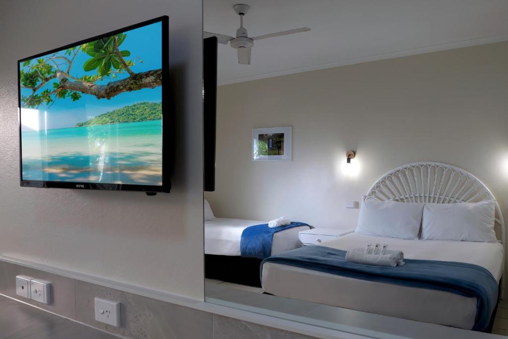 Postel nebo postele na pokoji v ubytování Hotel Tropiq