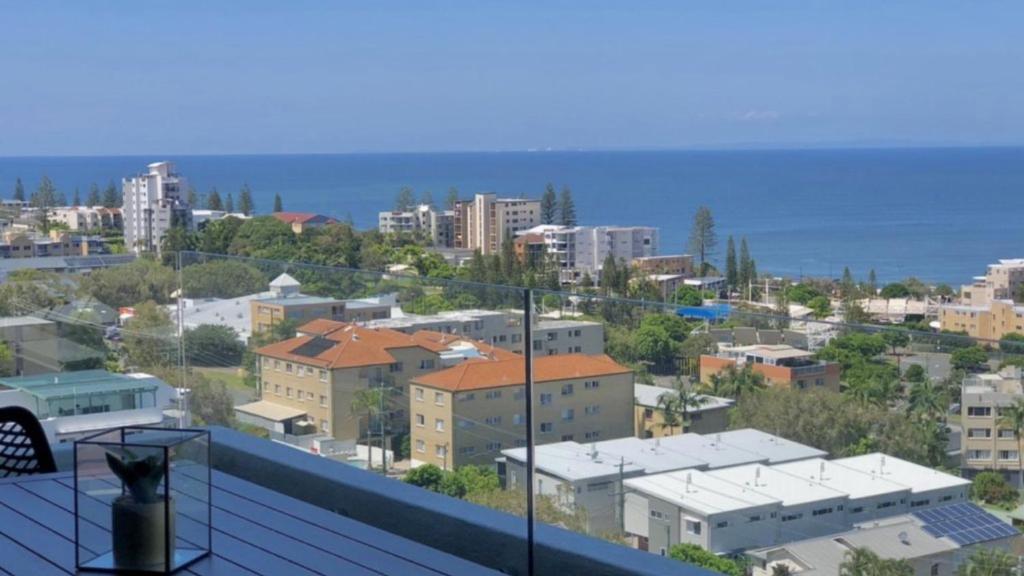 a view of a city with buildings and the ocean at #24 K I G Heights, Kings Beach - Stunning Views in Caloundra