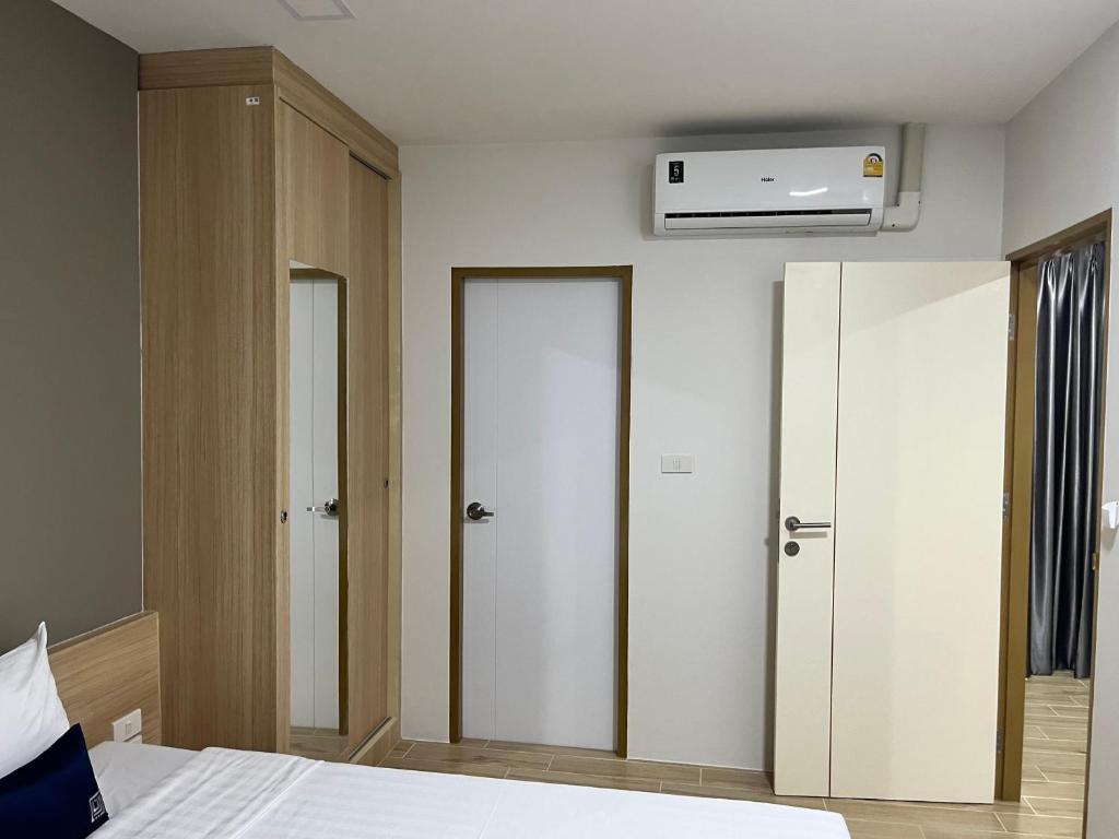 Postel nebo postele na pokoji v ubytování Zayn Express & Suites