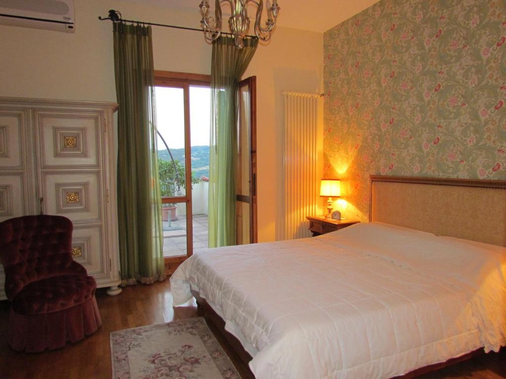 Postel nebo postele na pokoji v ubytování B&B Il Suono del Bosco