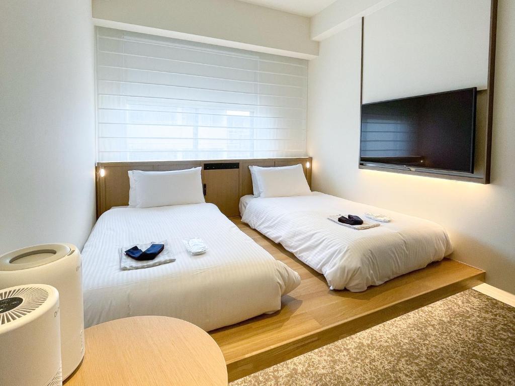 Postel nebo postele na pokoji v ubytování Park Hotel Kyoto