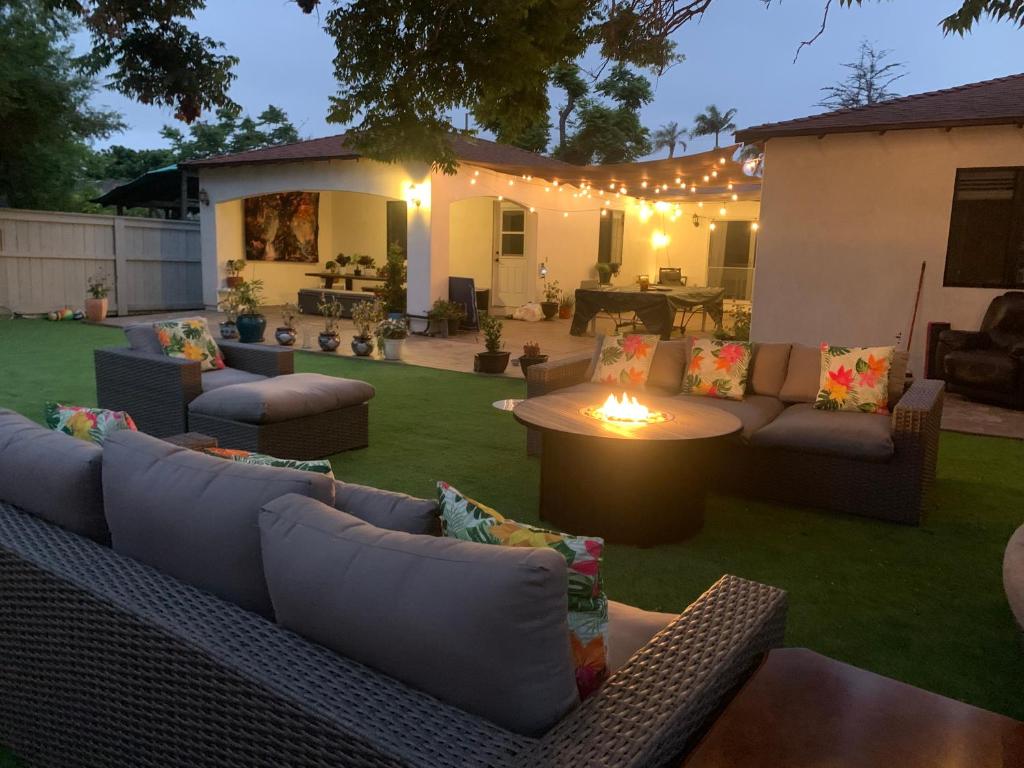 a patio with couches and a table with lights at Casa Sur in Chula Vista