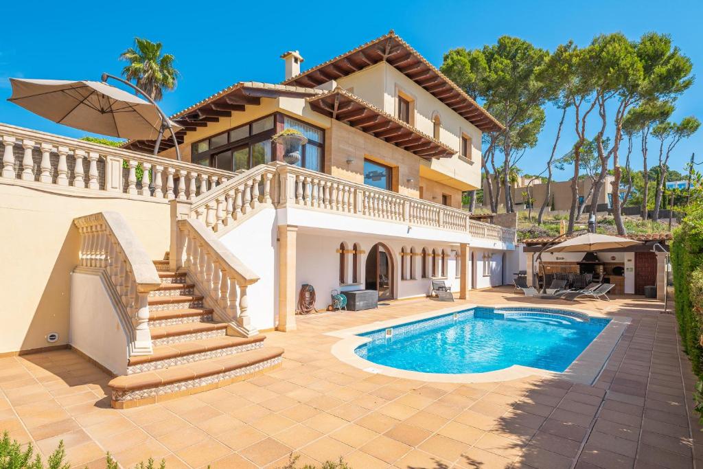 a villa with a swimming pool and a house at Villa Riviera in Costa d'en Blanes