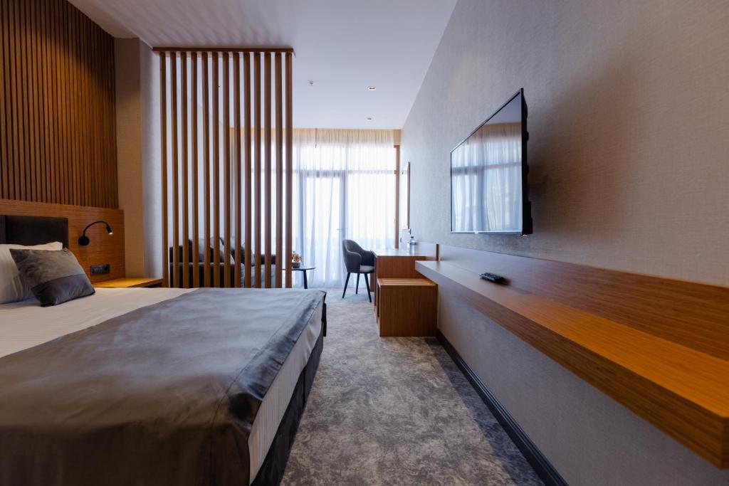 Postel nebo postele na pokoji v ubytování Hotel Monarch
