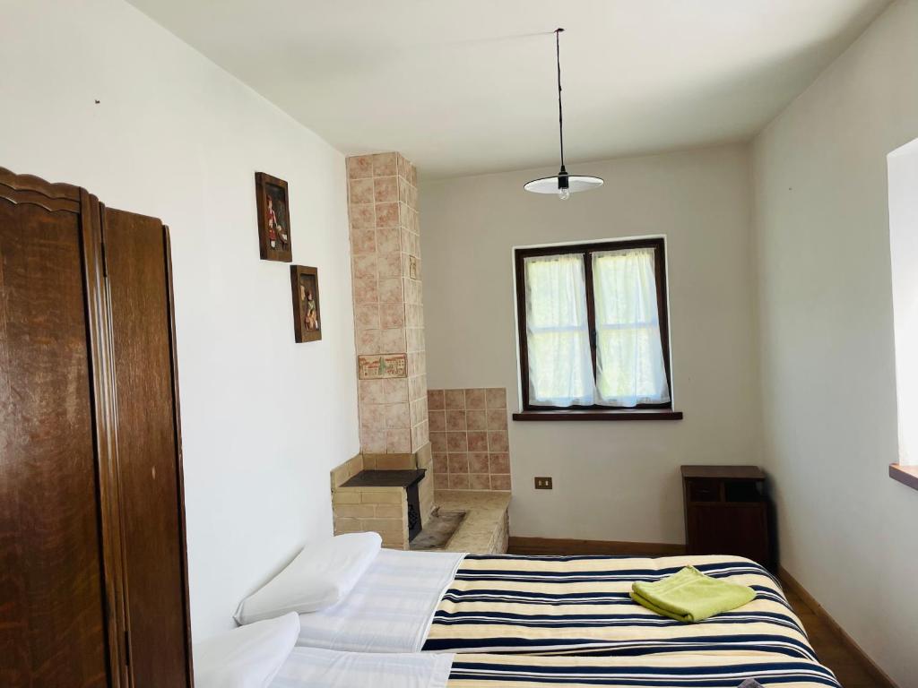 Postel nebo postele na pokoji v ubytování Maso Mandrea