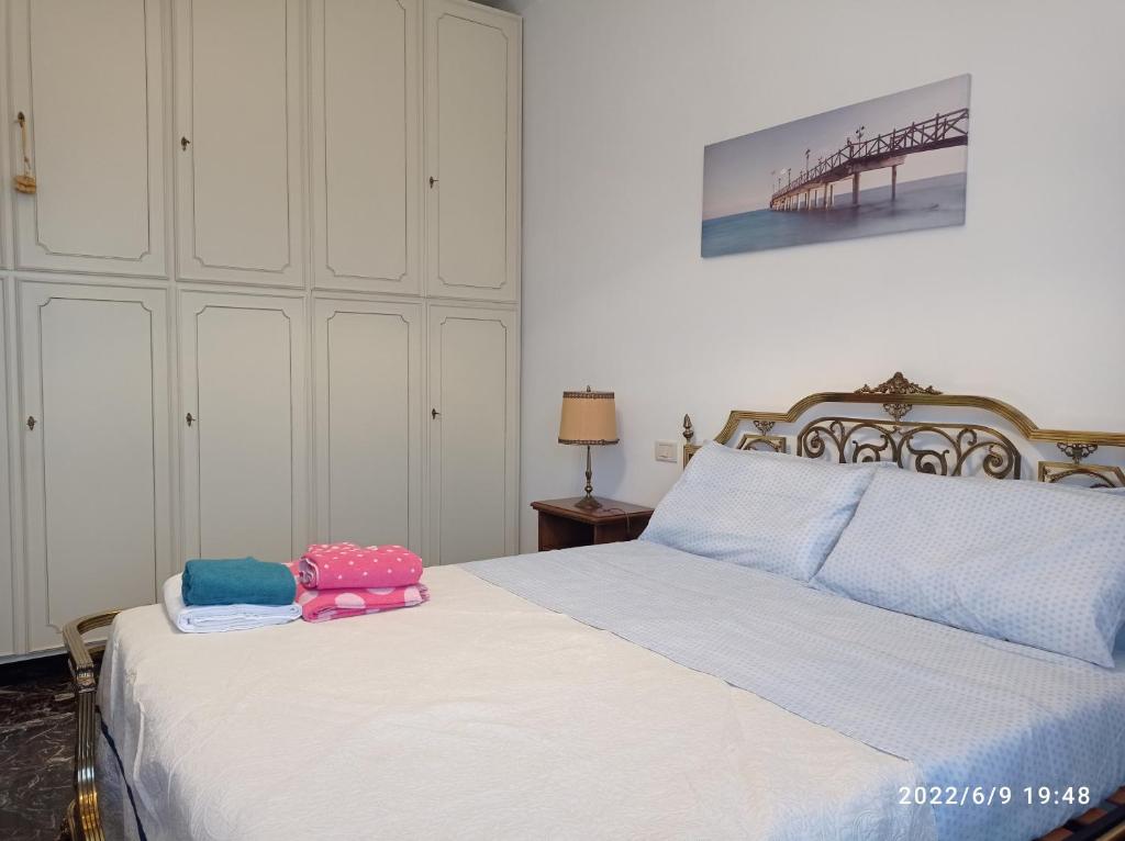 a bedroom with a bed with two bags on it at DOWN TOWN EMILY in La Spezia